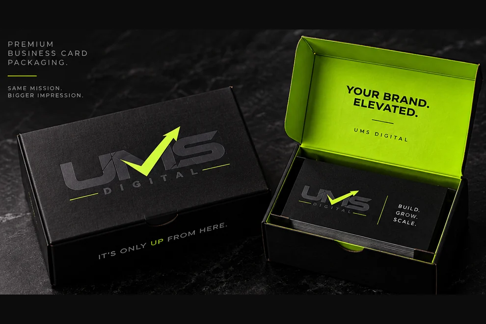 UMS Digital business card box concept: a black box with a green interior and a stack of cards